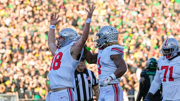 Oct 12, 2024; Eugene, Oregon, USA; Ohio State Buckeyes quarterback Will Howard (18) celebrates scoring a touchdown during the first half of the NCAA football game against the Oregon Ducks at Autzen Stadium