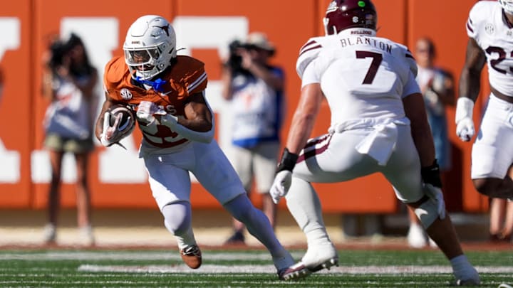 Sep 28, 2024; Austin, Texas, USA; Texas Longhorns running back Jaydon Blue (23) runs the ball in front of Mississippi State Bulldogs linebacker Stone Blanton (7) in the first half at Darrell K Royal-Texas Memorial Stadium. Mandatory Credit: Daniel Dunn-Imagn Images Sep 28, 2024; Austin, Texas, USA; Texas Longhorns running back Jaydon Blue (23) runs the ball in front of Mississippi State Bulldogs linebacker Stone Blanton (7) in the first half at Darrell K Royal-Texas Memorial Stadium. Mandatory Credit: Daniel Dunn-Imagn Images