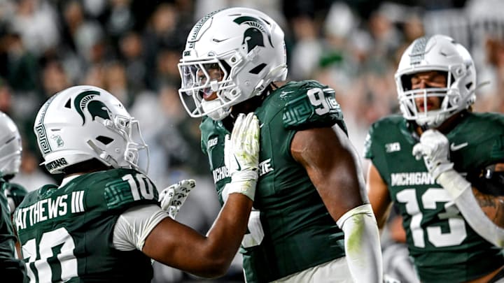 Michigan State's Jalen Thompson, right, celebrates his tackle for a safety against Western Michigan during the third quarter on Friday, Aug. 29, 2025, in East Lansing.