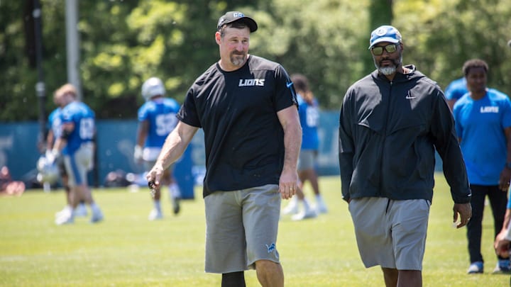 Lions head coach Dan Campbell walks off the field with general manager Brad Holmes after the organized team activities in Allen Park on Thursday, May 23, 2024.