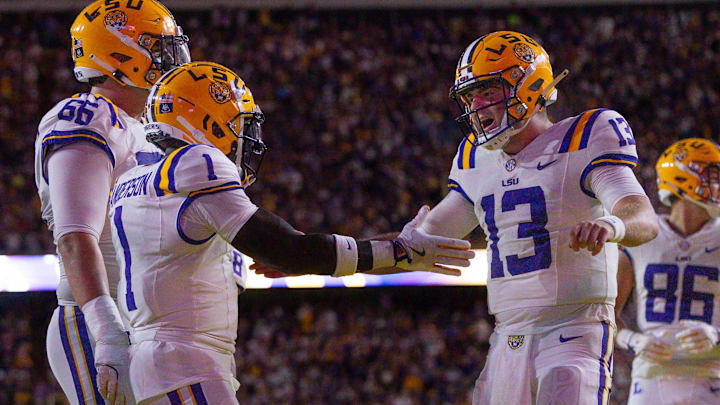 Sep 28, 2024; Baton Rouge, Louisiana, USA;  LSU Tigers wide receiver Aaron Anderson (1) celebrates a touchdown with quarterback Garrett Nussmeier (13) against the South Alabama Jaguars during the first quarter at Tiger Stadium. Mandatory Credit: Stephen Lew-Imagn Images