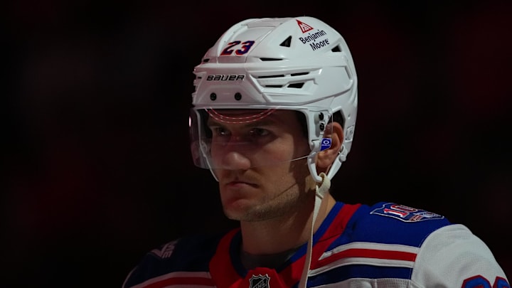Nov 26, 2025; Raleigh, North Carolina, USA; New York Rangers defenseman Adam Fox (23) looks on before the start of the game against the Carolina Hurricanes at Lenovo Center. Mandatory Credit: James Guillory-Imagn Images Nov 26, 2025; Raleigh, North Carolina, USA; New York Rangers defenseman Adam Fox (23) looks on before the start of the game against the Carolina Hurricanes at Lenovo Center. Mandatory Credit: James Guillory-Imagn Images