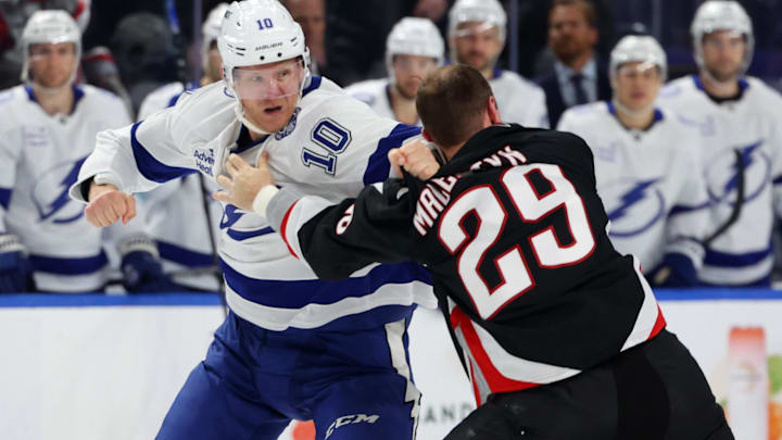 Mar 8, 2026; Buffalo, New York, USA;  Tampa Bay Lightning right wing Corey Perry (10) and Buffalo Sabres left wing Beck Malenstyn (29) fight during the second period at KeyBank Center. Mandatory Credit: Timothy T. Ludwig-Imagn Images
