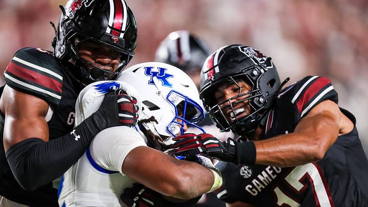 Sep 27, 2025; Columbia, South Carolina, USA; Kentucky Wildcats running back Dante Dowdell (2) is stopped by South Carolina Gamecocks linebacker Dylan Stewart (6) and linebacker Justin Okoronkwo (17) in the second quarter at Williams-Brice Stadium. Mandatory Credit: Jeff Blake-Imagn Images Sep 27, 2025; Columbia, South Carolina, USA; Kentucky Wildcats running back Dante Dowdell (2) is stopped by South Carolina Gamecocks linebacker Dylan Stewart (6) and linebacker Justin Okoronkwo (17) in the second quarter at Williams-Brice Stadium. Mandatory Credit: Jeff Blake-Imagn Images