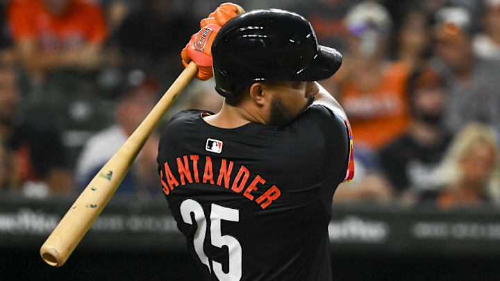Sep 20, 2024; Baltimore, Maryland, USA;  Baltimore Orioles outfielder Anthony Santander (25) swings through a first inning two run home run against the Detroit Tigers at Oriole Park at Camden Yards