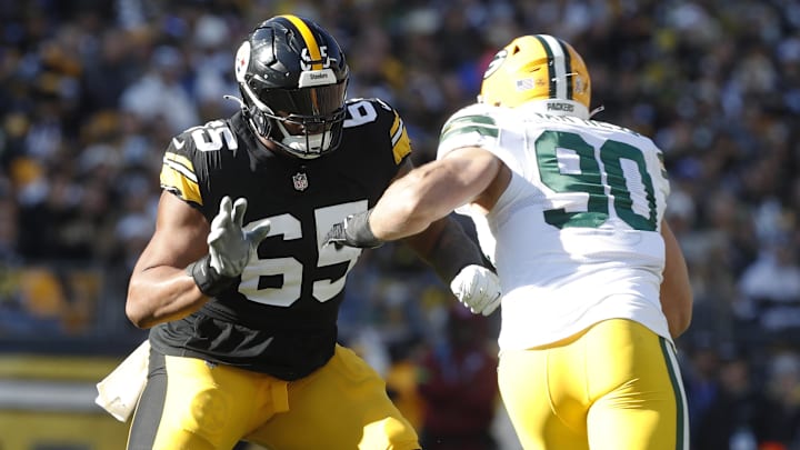 Pittsburgh Steelers offensive tackle Dan Moore Jr. blocks against Green Bay Packers linebacker Lukas Van Ness. Pittsburgh Steelers offensive tackle Dan Moore Jr. blocks against Green Bay Packers linebacker Lukas Van Ness.
