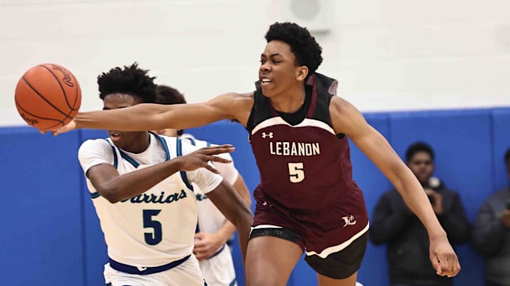 Lebanon forward Anthony Thompson (5) chases after a loose ball during their during their 50-61 loss to Winton Woods Friday, Jan. 5, 2024.