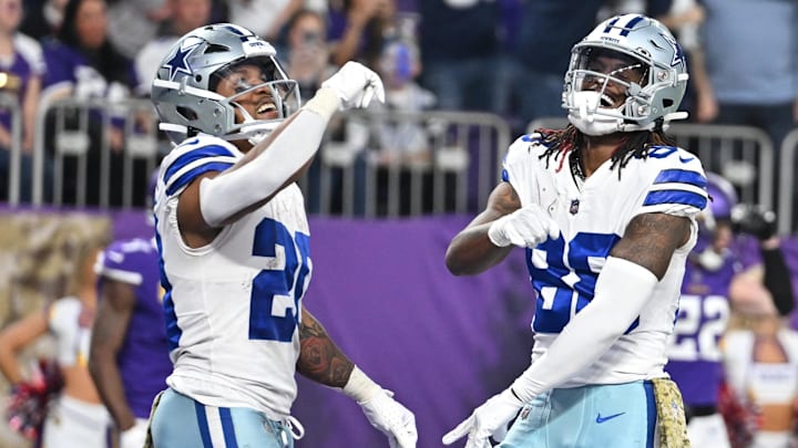 Nov 20, 2022; Minneapolis, Minnesota, USA; Dallas Cowboys running back Tony Pollard (20) and wide