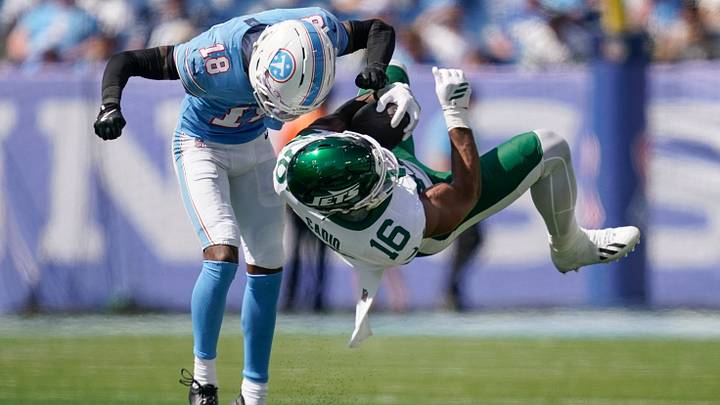 New York Jets tight end Kenyon Sadiq (16) is stopped by Tennessee Titans cornerback Cor'dale Flott (18) during the fourth quarter at Nissan Stadium in Nashville, Tenn., Sunday, Sept. 13, 2026. New York Jets tight end Kenyon Sadiq (16) is stopped by Tennessee Titans cornerback Cor'dale Flott (18) during the fourth quarter at Nissan Stadium in Nashville, Tenn., Sunday, Sept. 13, 2026.
