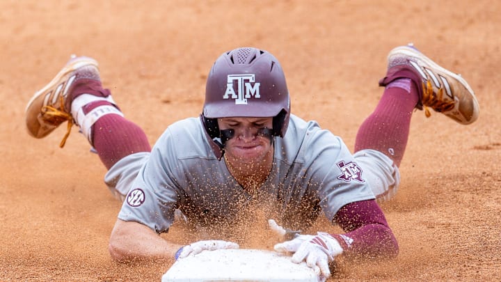 Texas A&M Aggies outfielder Caden Sorrell (13) slides into third.