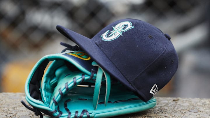 Hat and glove of Seattle Mariners center fielder Dee Gordon (9) sits in dugout during the third inning against the Detroit Tigers at Comerica Park in 2018.