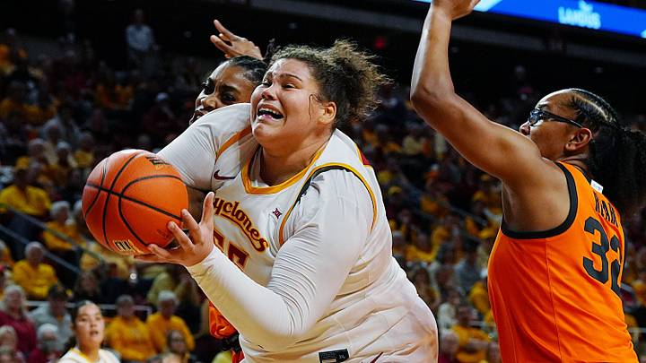 Iowa State Cyclones' center Audi Crooks (55) goes for a shot around Oklahoma State Cowgirls forward Achol Akot (11) and guard Stailee Heard (32) during the first quarter in the senior day women basketball at Hilton Coliseum on February. 25, 2026, in Ames, Iowa. Iowa State Cyclones' center Audi Crooks (55) goes for a shot around Oklahoma State Cowgirls forward Achol Akot (11) and guard Stailee Heard (32) during the first quarter in the senior day women basketball at Hilton Coliseum on February. 25, 2026, in Ames, Iowa.