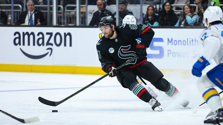 Mar 4, 2026; Seattle, Washington, USA; Seattle Kraken center Shane Wright (51) moves the puck in the second period against the St. Louis Blues at Climate Pledge Arena. Mandatory Credit: Kevin Ng-Imagn Images