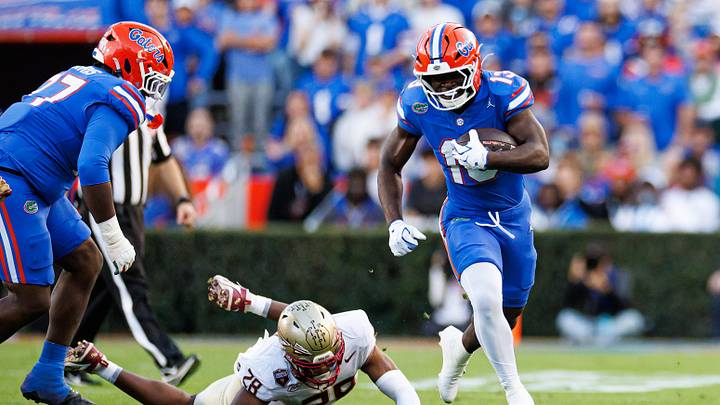 Nov 29, 2025; Gainesville, Florida, USA; Florida Gators running back Jadan Baugh (13) rushes with the ball against the Florida State Seminoles during the first half at Ben Hill Griffin Stadium. Mandatory Credit: Matt Pendleton-Imagn Images Nov 29, 2025; Gainesville, Florida, USA; Florida Gators running back Jadan Baugh (13) rushes with the ball against the Florida State Seminoles during the first half at Ben Hill Griffin Stadium. Mandatory Credit: Matt Pendleton-Imagn Images