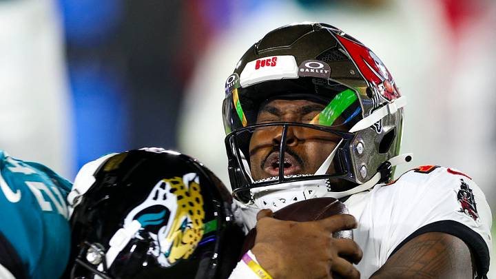 Aug 28, 2026; Jacksonville, Florida, USA; Jacksonville Jaguars safety Cam'ron Silmon-Craig (42) tackles Tampa Bay Buccaneers quarterback Jalon Daniels (10) in the third quarter during preseason at EverBank Stadium. Mandatory Credit: Nathan Ray Seebeck-Imagn Images