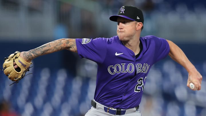 Jun 4, 2025; Miami, Florida, USA; Colorado Rockies starting pitcher Kyle Freeland (21) delivers a pitch against the Miami Marlins during the first inning at loanDepot Park. 