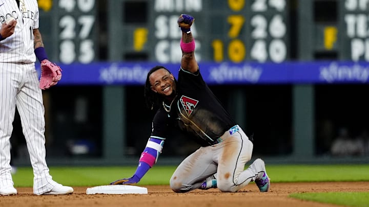 Jun 21, 2025; Denver, Colorado, USA; Arizona Diamondbacks second baseman Ketel Marte (4) reacts after a double in the fourth inning against the Colorado Rockies at Coors Field. Mandatory Credit: Ron Chenoy-Imagn Images