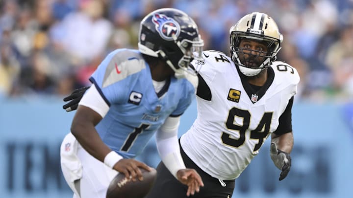 Dec 28, 2025; Nashville, Tennessee, USA; New Orleans Saints defensive end Cameron Jordan (94) gives chase to Tennessee Titans quarterback Cam Ward (1) during the second half of the game at Nissan Stadium. Mandatory Credit: Steve Roberts-Imagn Images Dec 28, 2025; Nashville, Tennessee, USA; New Orleans Saints defensive end Cameron Jordan (94) gives chase to Tennessee Titans quarterback Cam Ward (1) during the second half of the game at Nissan Stadium. Mandatory Credit: Steve Roberts-Imagn Images