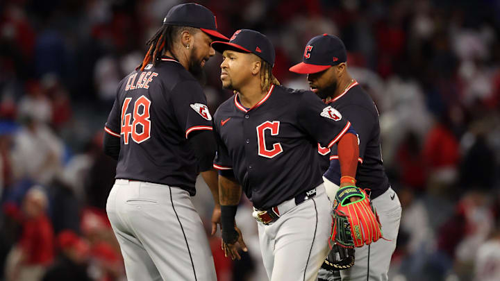 Apr 4, 2025; Anaheim, California, USA;  Cleveland Guardians third baseman Jose Ramirez (11, center) celebrates a win with pitcher Emmanuel Clase (48) after defeating the Los Angeles Angels at Angel Stadium. Mandatory Credit: Kiyoshi Mio-Imagn Images
