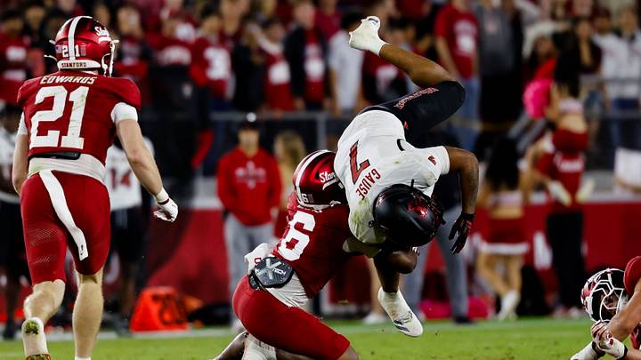 Oct 23, 2026; Stanford, California, USA;  NC State Wolfpack running back Davion Gause (7) gets tackled by Stanford Cardinal safety Darrius Davis (6) during the second quarter at Stanford Stadium.  Mandatory Credit: Sergio Estrada-Imagn Images