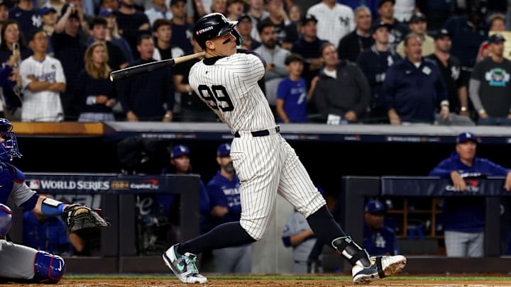 New York Yankees outfielder Aaron Judge (99) hits a two-run home run during the first inning against the Los Angeles Dodgers in game five of the 2024 MLB World Series at Yankee Stadium. New York Yankees outfielder Aaron Judge (99) hits a two-run home run during the first inning against the Los Angeles Dodgers in game five of the 2024 MLB World Series at Yankee Stadium.