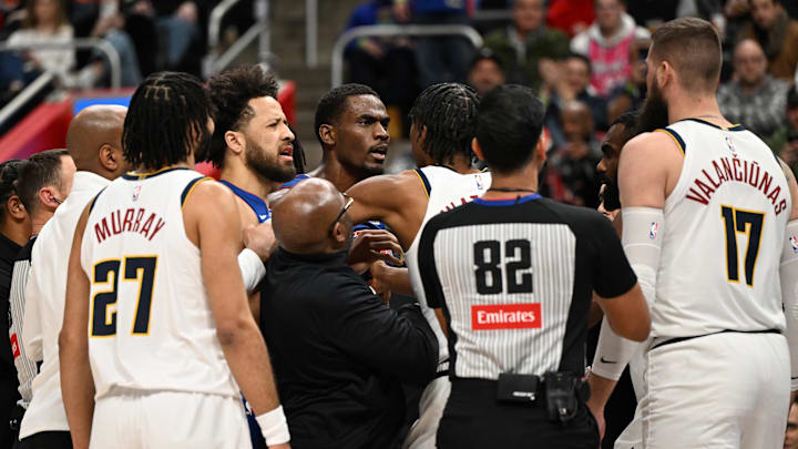 Feb 3, 2026; Detroit, Michigan, USA; Detroit Pistons guard Cade Cunningham (2) and Detroit Pistons center Jalen Duren (0) have to be separated from Denver Nuggets center Jonas Valanciunas (17) after Valanciunas and Detroit Pistons forward Isaiah Stewart (not pictured) got into an altercation in the first quarter at Little Caesars Arena. Mandatory Credit: Lon Horwedel-Imagn Images