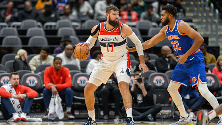 Oct 18, 2024; Washington, District of Columbia, USA; Washington Wizards center Jonas Valanciunas (17) dribbles the ball while being defended by New York Knicks center Karl-Anthony Towns (32) during the first quarter at Capital One Arena. Mandatory Credit: Reggie Hildred-Imagn Images