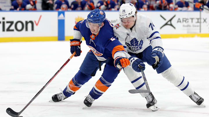 Jan 11, 2024; Elmont, New York, USA; New York Islanders defenseman Mike Reilly (2) fights for the