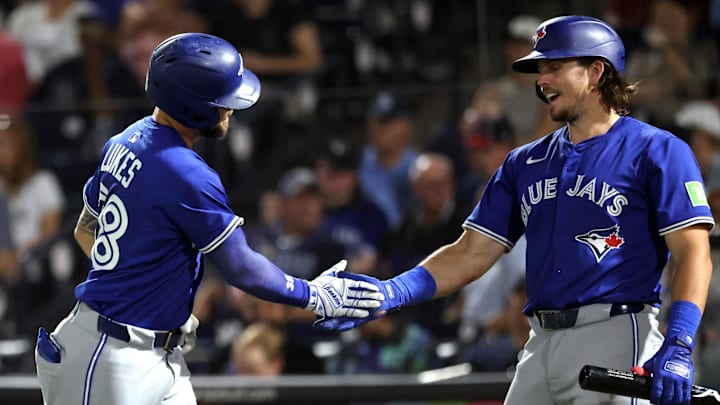 Toronto Blue Jays right fielder Nathan Lukes (38) is congratulated by third baseman Addison Barger (47) after he hit a home run during the fourth inning against the Tampa Bay Rays at George M. Steinbrenner Field. Toronto Blue Jays right fielder Nathan Lukes (38) is congratulated by third baseman Addison Barger (47) after he hit a home run during the fourth inning against the Tampa Bay Rays at George M. Steinbrenner Field.
