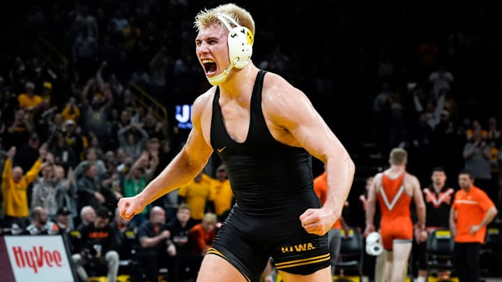 Iowa’s Angelo Ferrari reacts after defeating Oklahoma State's Dustin Plott by sudden victory in a 184-pound match Sunday, Feb. 23, 2025 at Carver-Hawkeye Arena in Iowa City, Iowa.