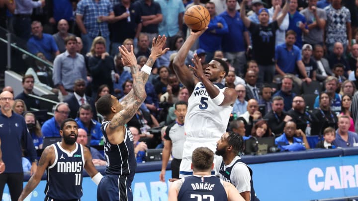May 28, 2024; Dallas, Texas, USA; Minnesota Timberwolves guard Anthony Edwards (5) shoots over Dallas Mavericks forward P.J. Washington (25) during the second quarter of game four of the western conference finals for the 2024 NBA playoffs at American Airlines Center. Mandatory Credit: Kevin Jairaj-USA TODAY Sports