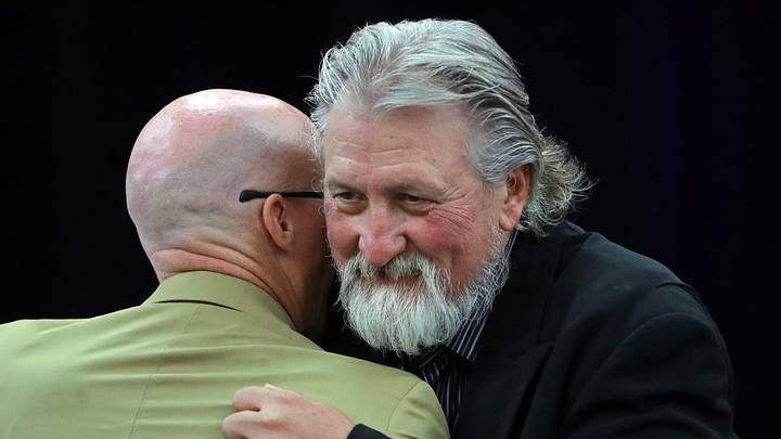 Former Zips basketball coach Bob Huggins, facing, hugs current coach John Groce after speaking during the Akron Basketball reunion and celebration at the University of Akron student union, Saturday, July 27, 2024, in Akron, Ohio. Former Zips basketball coach Bob Huggins, facing, hugs current coach John Groce after speaking during the Akron Basketball reunion and celebration at the University of Akron student union, Saturday, July 27, 2024, in Akron, Ohio.