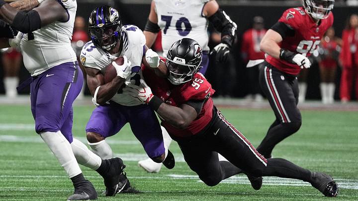 Ravens running back Justice Hill tries to get away from Atlanta Falcons defensive tackle Gervon Dexter, the former Bear. Ravens running back Justice Hill tries to get away from Atlanta Falcons defensive tackle Gervon Dexter, the former Bear.