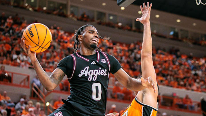 Nov 9, 2025; Stillwater, Oklahoma, USA; Texas A&M Aggies guard Marcus Hill (0) passes the ball during the second half against the Oklahoma State Cowboys at Gallagher-Iba Arena. Mandatory Credit: William Purnell-Imagn Images