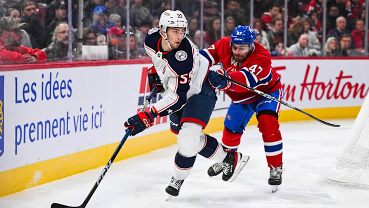 Nov 16, 2024; Montreal, Quebec, CAN; Columbus Blue Jackets defenseman David Jiricek (55) plays the puck against Montreal Canadiens defenseman Jayden Struble (47) during the third period at Bell Centre. Mandatory Credit: David Kirouac-Imagn Images