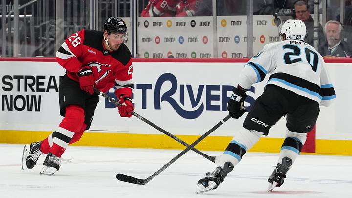 New Jersey Devils right wing Timo Meier (28) skates with the puck while Utah Mammoth defenseman Andrew Peeke (20) defends during the second period at Prudential Center. Mandatory Credit: Ed Mulholland-Imagn Images New Jersey Devils right wing Timo Meier (28) skates with the puck while Utah Mammoth defenseman Andrew Peeke (20) defends during the second period at Prudential Center. Mandatory Credit: Ed Mulholland-Imagn Images
