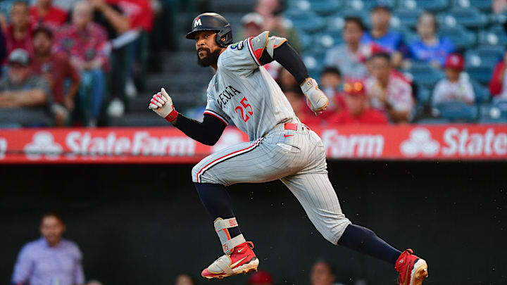 Sep 9, 2025; Anaheim, California, USA; Minnesota Twins center fielder Byron Buxton (25) hits a single against the Los Angeles Angels during the first inning at Angel Stadium. Mandatory Credit: Gary A. Vasquez-Imagn Images