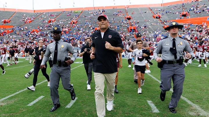 Oct 10, 2026; Gainesville, Florida, USA;  South Carolina Gamecocks head coach Shane Beamer runs to meet the Florida head coach after a game against the Florida Gators at Ben Hill Griffin Stadium.  Mandatory Credit: Matt Pendleton-Imagn Images