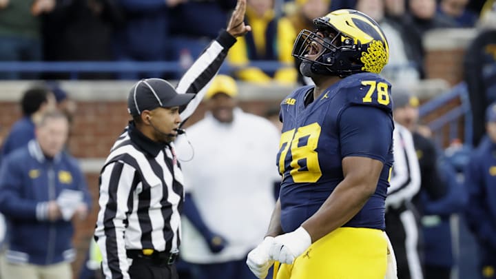 Nov 23, 2024; Ann Arbor, Michigan, USA; Michigan Wolverines defensive lineman Kenneth Grant (78) celebrates after sacking Northwestern Wildcats quarterback Jack Lausch (not pictured) in the first half at Michigan Stadium. Mandatory Credit: Rick Osentoski-Imagn Images Nov 23, 2024; Ann Arbor, Michigan, USA; Michigan Wolverines defensive lineman Kenneth Grant (78) celebrates after sacking Northwestern Wildcats quarterback Jack Lausch (not pictured) in the first half at Michigan Stadium. Mandatory Credit: Rick Osentoski-Imagn Images