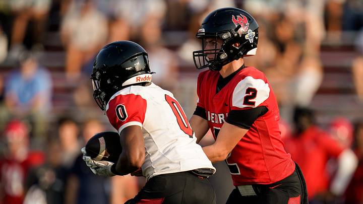Pearl-Cohn quarterback LJ Funk (2) hands off to Lance Donaldson (0) during a pre-season scrimmage against Brentwood Academy at Pearl-Cohn High School in Nashville, Tenn., Monday, Aug. 10, 2026. Pearl-Cohn quarterback LJ Funk (2) hands off to Lance Donaldson (0) during a pre-season scrimmage against Brentwood Academy at Pearl-Cohn High School in Nashville, Tenn., Monday, Aug. 10, 2026.