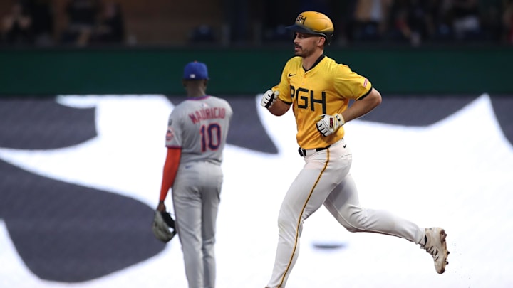 Jun 27, 2025; Pittsburgh, Pennsylvania, USA;  Pittsburgh Pirates right fielder Bryan Reynolds (right) circles the base on a three run home run against the New York Mets during the sixth inning at PNC Park. Mandatory Credit: Charles LeClaire-Imagn Images