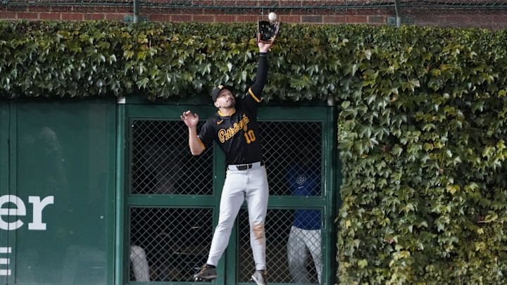 Sep 3, 2024; Chicago, Illinois, USA; Pittsburgh Pirates outfielder Bryan Reynolds (10) makes a catch on Chicago Cubs designated hitter Seiya Suzuki (not pictured) during the fifth inning at Wrigley Field. Mandatory Credit: David Banks-Imagn Images