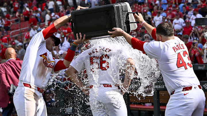 Sep 22, 2024; St. Louis, Missouri, USA;  St. Louis Cardinals relief pitcher Ryan Helsley (56) is doused with water by center fielder Lars Nootbaar (21) and catcher Pedro Pages (43) after the Cardinals defeated the Cleveland Guardians at Busch Stadium. Mandatory Credit: Jeff Curry-Imagn Images