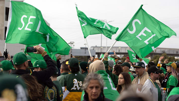 Mar 28, 2024; Oakland, California, USA; Oakland Athletics fans wave “Sell” flags to protest
