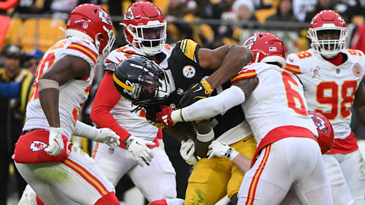 Dec 25, 2024; Pittsburgh, Pennsylvania, USA; Kansas City Chiefs safety Bryan Cook (6) tackles Pittsburgh Steelers running back Najee Harris (22) during the second half at Acrisure Stadium. Mandatory Credit: Barry Reeger-Imagn Images
