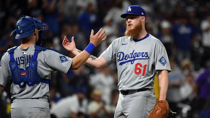 Jun 25, 2025; Denver, Colorado, USA; Los Angeles Dodgers pitcher Will Klein (61) celebrates with catcher Dalton Rushing (68) after a win against the Colorado Rockies at Coors Field. Mandatory Credit: Christopher Hanewinckel-Imagn Images