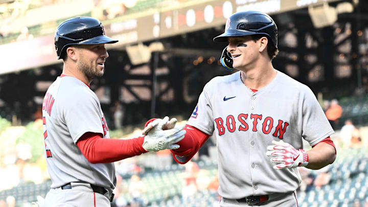Aug 27, 2025; Baltimore, Maryland, USA;  Boston Red Sox outfielder Roman Anthony (19) celebrates hitting a solo home run during the first inning with third baseman Alex Bregman (2) against the Baltimore Orioles at Oriole Park at Camden Yards. Mandatory Credit: James A. Pittman-Imagn Images
