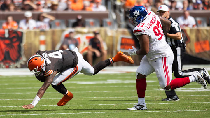Sep 22, 2024; Cleveland, Ohio, USA; Cleveland Browns quarterback Deshaun Watson (4) stumbles away from New York Giants defensive tackle Dexter Lawrence II (97) during the second quarter at Huntington Bank Field. Sep 22, 2024; Cleveland, Ohio, USA; Cleveland Browns quarterback Deshaun Watson (4) stumbles away from New York Giants defensive tackle Dexter Lawrence II (97) during the second quarter at Huntington Bank Field.
