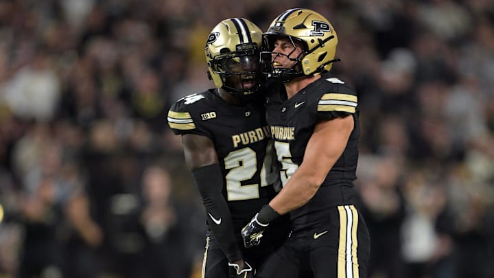 Purdue Boilermakers running back Malachi Thomas (24) celebrates a sack with Purdue Boilermakers linebacker Charles Correa (5)
