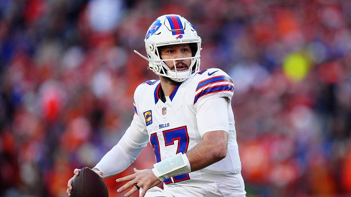 Buffalo Bills quarterback Josh Allen (17) rolls out during the second quarter of an AFC Divisional Round playoff game against the Denver Broncos at Empower Field at Mile High. 